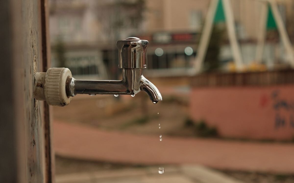 Outdoor tap dripping water from a worn washer