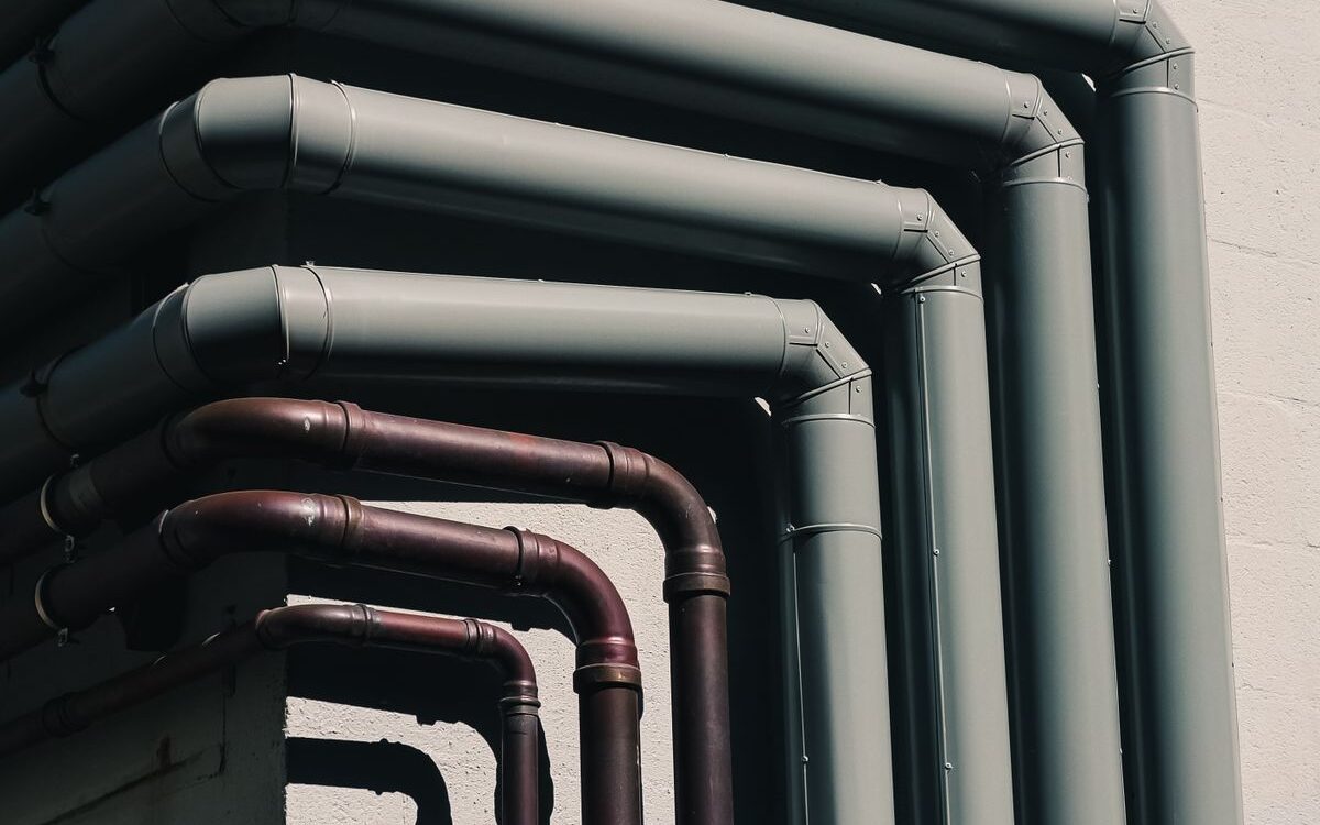 Rows of water supply pipes where backflow prevention devices are fitted