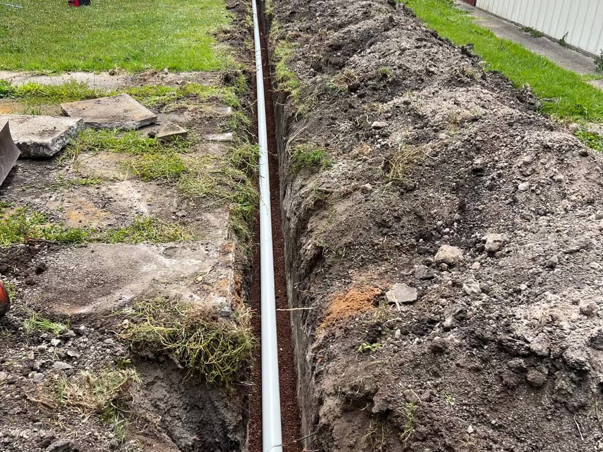 New pipe run in a trench to the house