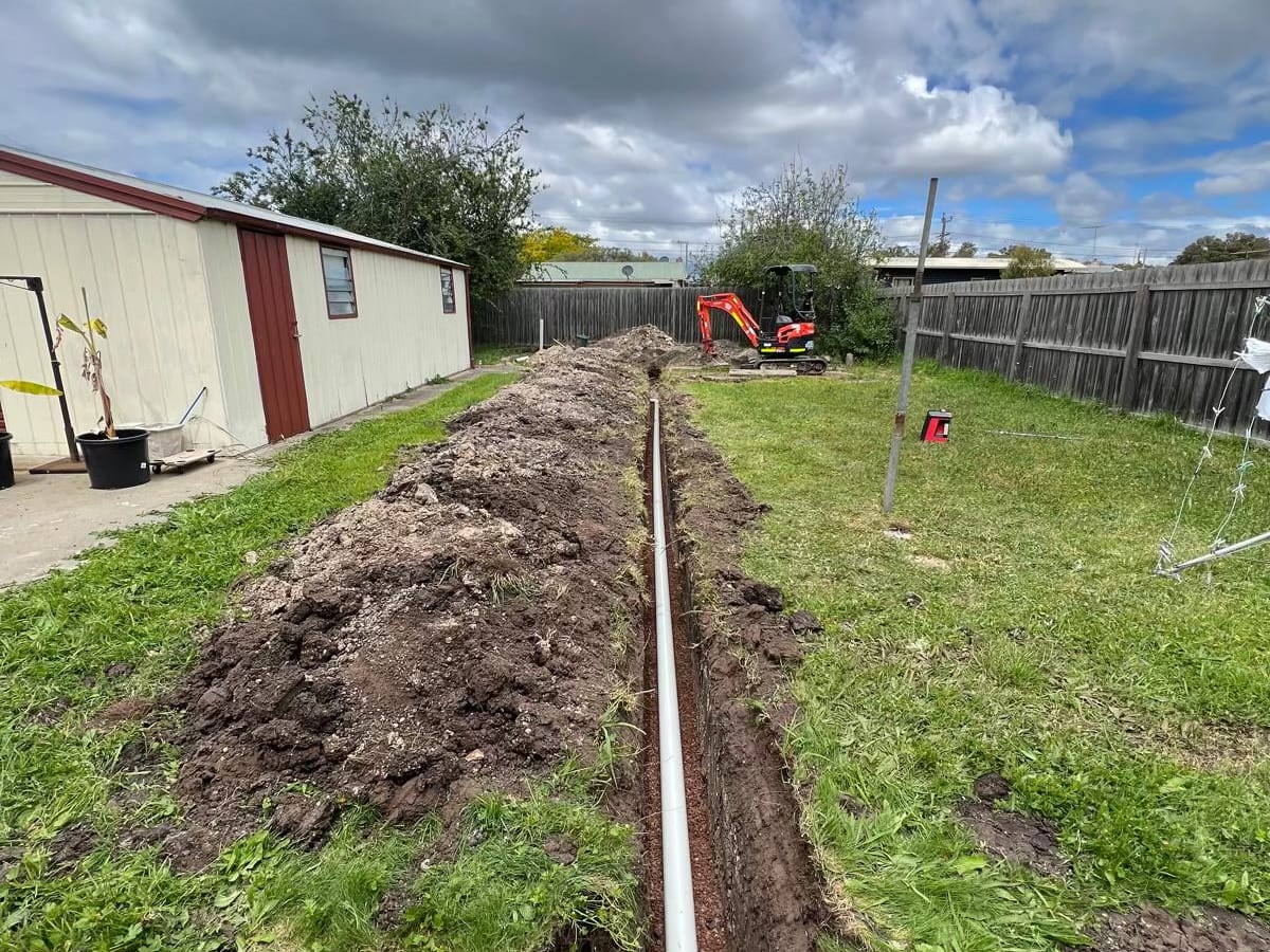 Stormwater pipe laid in a backyard trench