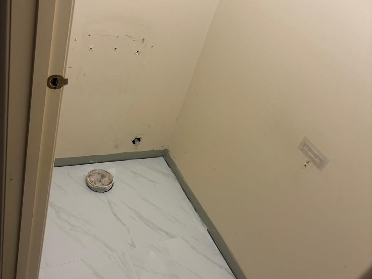 Toilet room tiled and ready for the new toilet