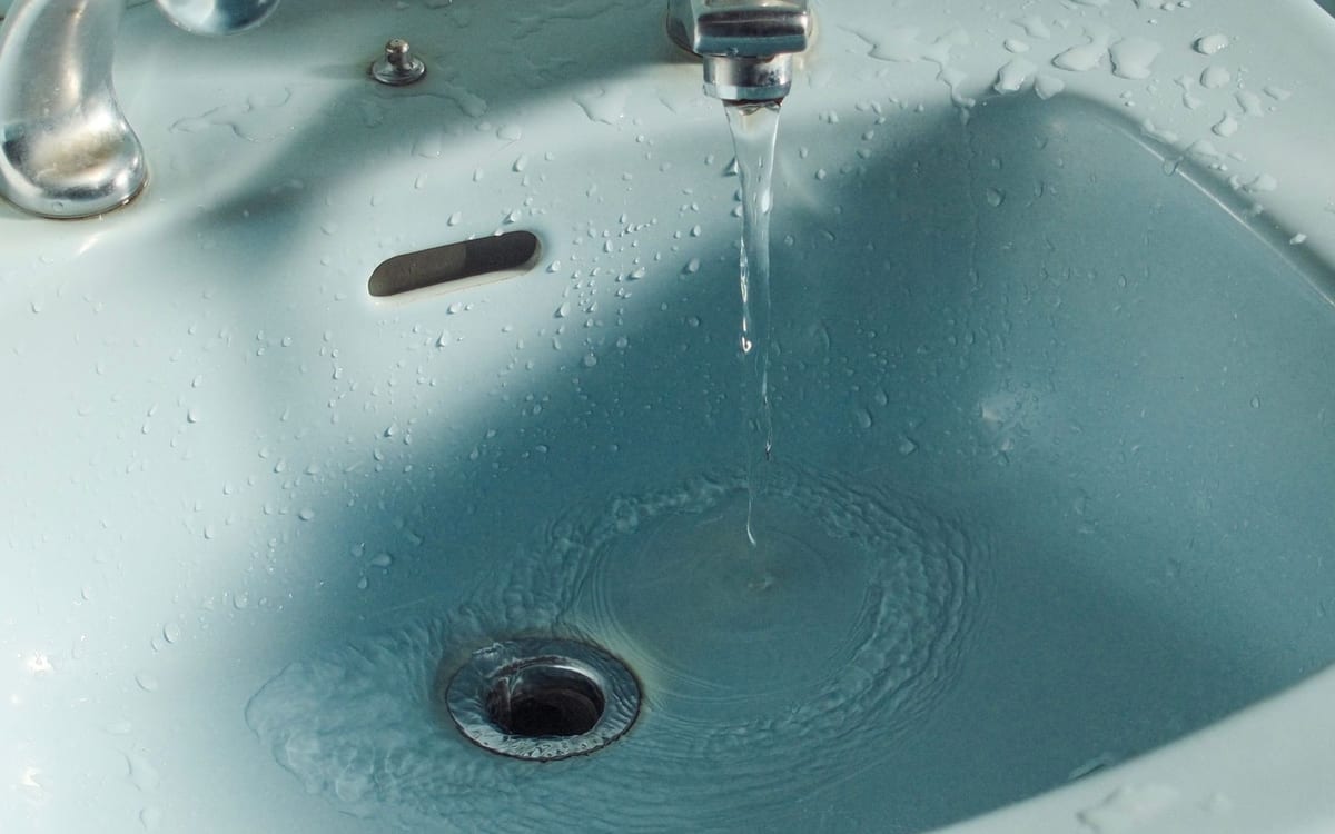 Bath tap running at a trickle